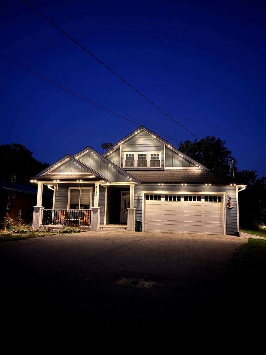 White soffit lighting suburban home